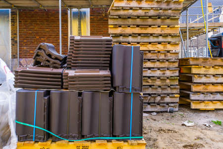 pallet with packages of roof tiling, construction site in Rucphen, The Netherlands, 6 may, 2022の写真素材