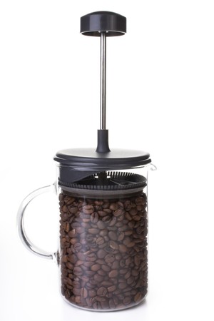 French press full of coffee beans, vertical orientation.の写真素材