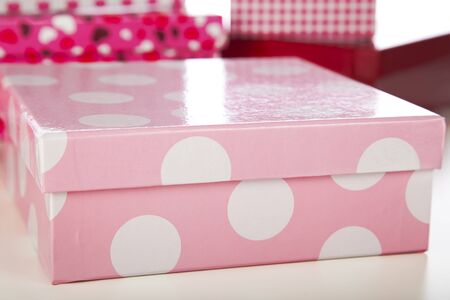 Decorative pink and while polka dot gift box closeup.の写真素材