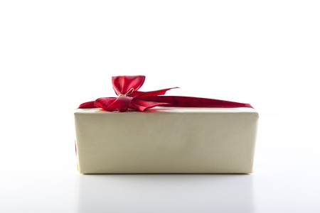GIft with red ribbon isolated on white background.の写真素材