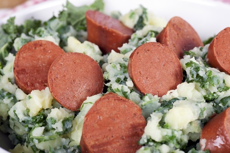 Dutch stamppot, mashed potatoes with kale, topped with vegetarian sausage.の写真素材
