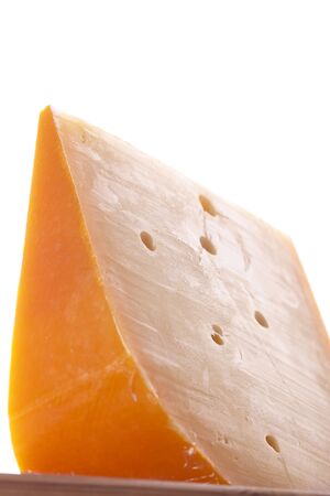 Cheese Wedge from shot from low angle isolated on white backgroundの写真素材