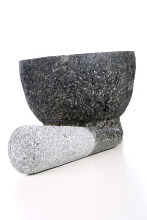 Granite mortar and pestle isolated on white background.の写真素材