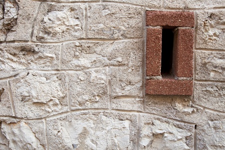 Old stone wall with ventilation gap.の写真素材