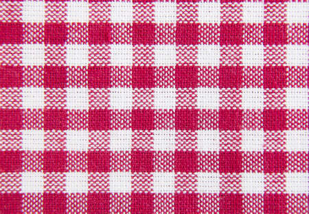 Red and white checkered pattern fabric background.の写真素材