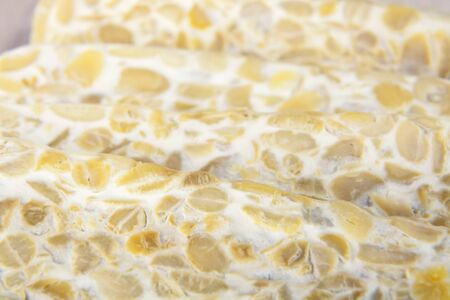 Close-up of fresh tempeh, a vegetarian soy product.の写真素材