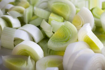 Group of fresh sliced leeks filling frame.の写真素材