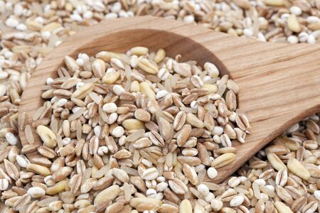 Mixed healthy grains with wooden spoon の写真素材