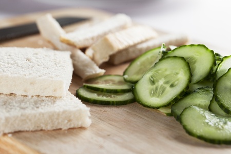 White bread with crust cut off and cucumbers to make cucumber sandwiches for afternoon teaの写真素材