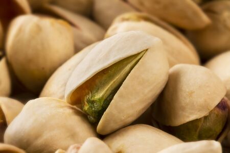 Close up of a pistachio nut in a groupの写真素材