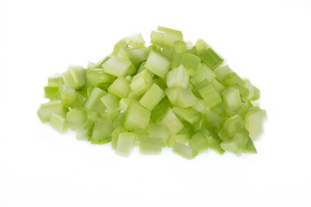 Chopped raw celery isolated on white background の写真素材