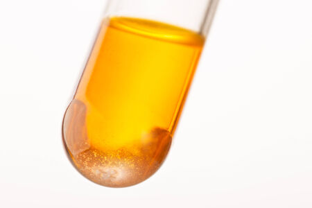 Close up of orange liquid in test tubeの写真素材