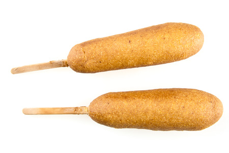 Two corn dogs isolated on white background.の写真素材