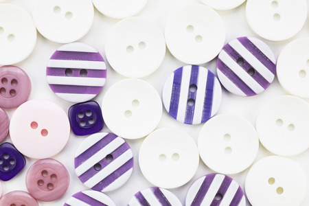 Colorful button texture with pink, purple and white buttons.の写真素材