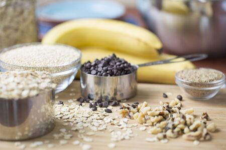 Ingredients for baking healthy banana chocolate chip oat bars.の写真素材
