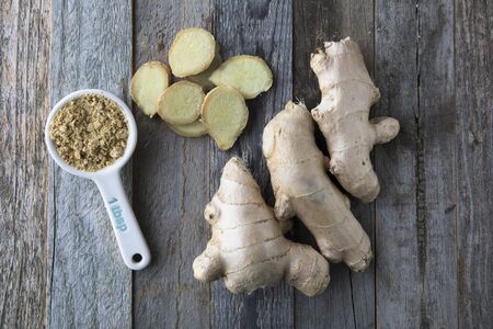 Ginger root, slices, and powder viewed from above.の写真素材