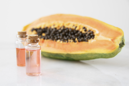 Small bottles of papaya extract with papaya fruitの写真素材