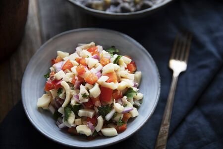 Vegan salad with hearts of palm, red onion, pepper, cilantro and lime dressing.の写真素材