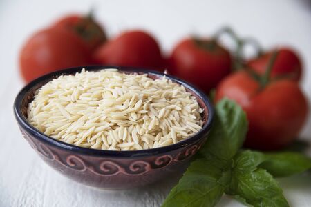 Bowl of Dried Orzo Pastaの写真素材