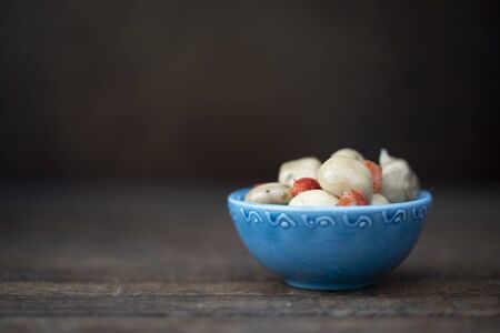 Bowl of Marinated Mushrooms on the table.の写真素材