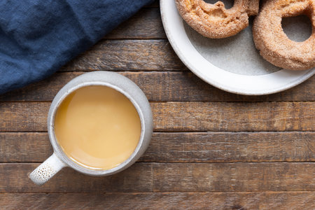 Coffee and Donuts on Rustic Wooden Table.の写真素材