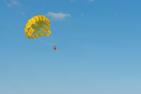 three people Parasailing of the coast of Gozo Malta near comino bluelagoon.の写真素材