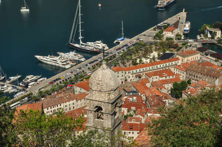 A panoramic view of the Bay of Kotor, cruise port, mountains and the medieval walled old town from the ruins of the Castle of San Giovanniのeditorial素材