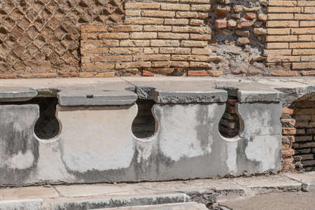 Latrina presso le terme del foro. Ancient public toilets (latrines) located at Ostia Atica (the ancient port of Rome)の写真素材