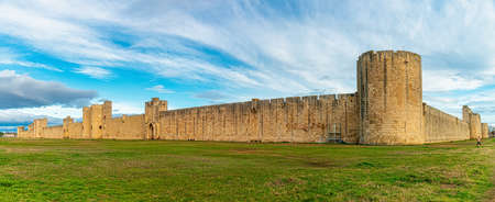 The medieval port city of Aigues-Mortes. Antique walls and picturesque powerful gates surround the...