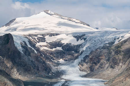 Panoramic view of the glacier in the mountains. The mountain is covered with snow.の写真素材
