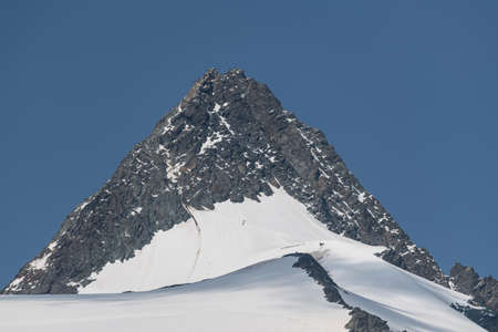 Mountain peak in the Swiss Alps on a sunny winter day.の写真素材