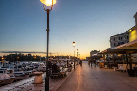 Harbor and prommenade of Rovinj at autumn sunset, Istria, Croatiaの写真素材