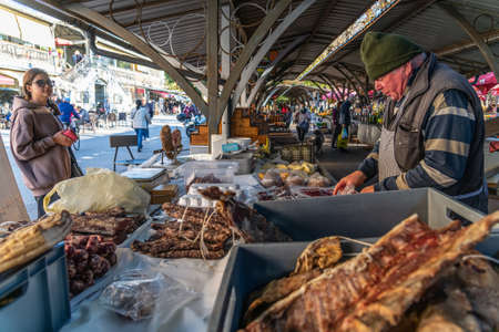 Customers shop for fresh fruit and vegetables on a sunny autumn day at Pula's City market ( Trznica ), Pula, Croatiaのeditorial素材