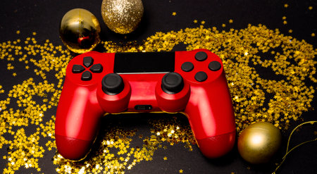 Joystick gaming controller with stars gold background. Holiday sale or black friday concept. Top...