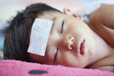 Sick kids heat from feverの写真素材