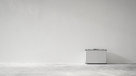 Aluminum suitcase on the ground
