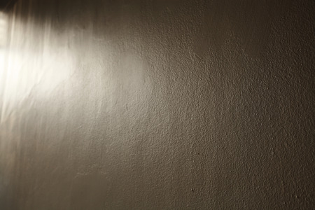 Lighting dark concrete wall