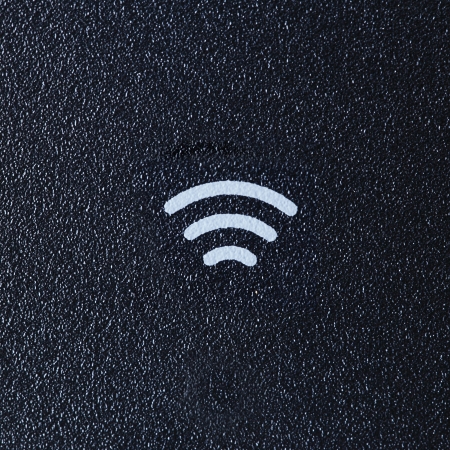 Wireless sign on dark Plastic background