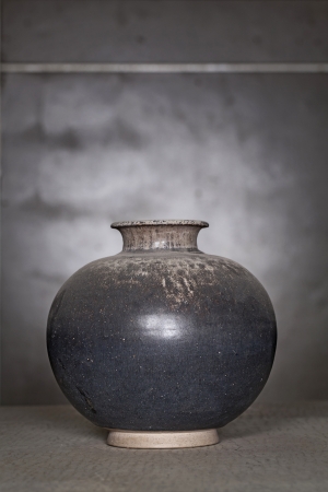 Antique scratch black ceramic vase (Still life)の写真素材