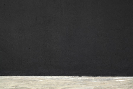 Black wall in concrete room