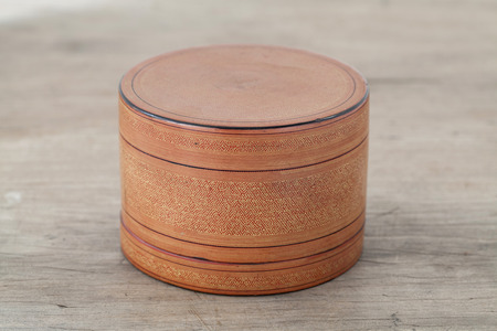 Antique lacquer wares on wooden tableの写真素材