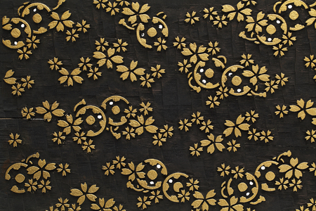 Flora carve with gold gild on antique wooden plateの写真素材