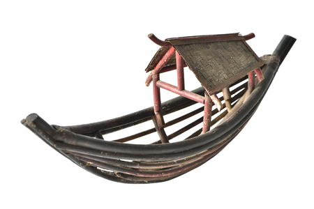 Antique small wood boat isolated on white backgroundの写真素材