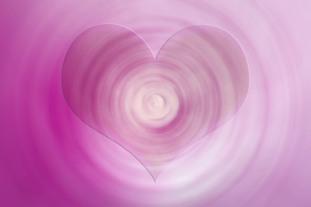 Heart on pink spiral blur backgroundの写真素材