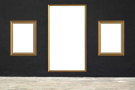 Antique gold wood frame on black concrete wall in concrete roomの写真素材