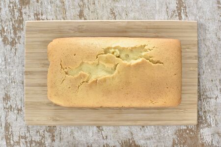 Butter cake on wood plate Top viewの写真素材