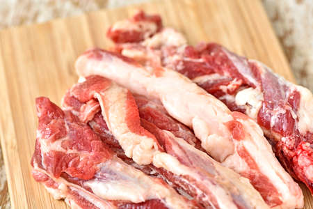 Fresh raw side beef on wood plateの写真素材