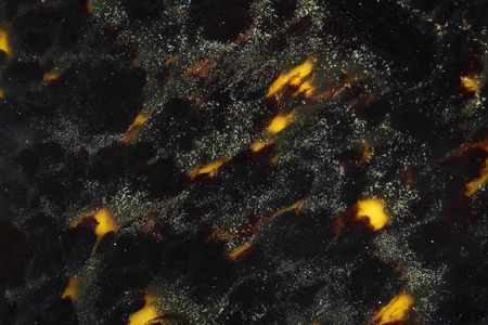 Yellow in black abstract background texture