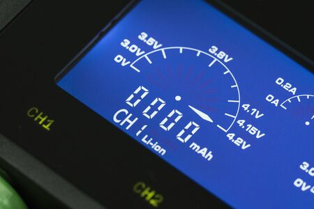 Battery charger with watt and volt checkerの写真素材