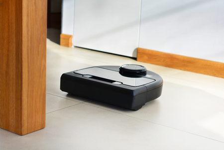 A robot technology vacuum cleaner cleaning homeの写真素材